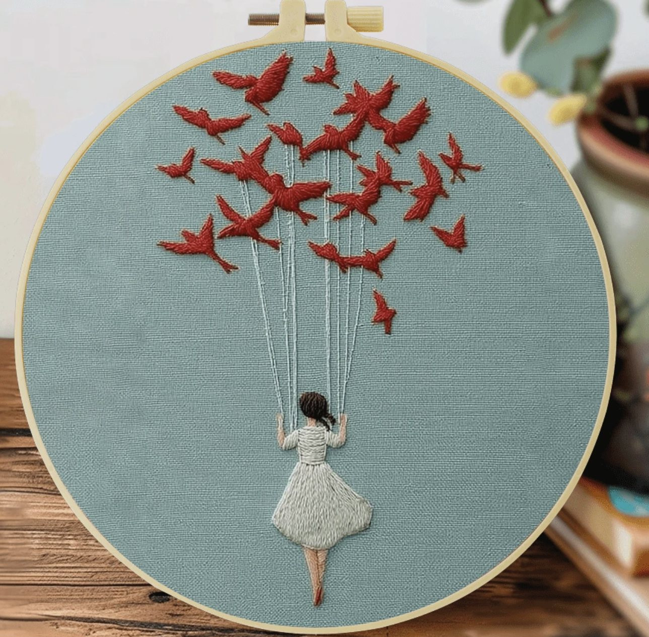 Kit broderie — Jeune fille portée par les oiseaux